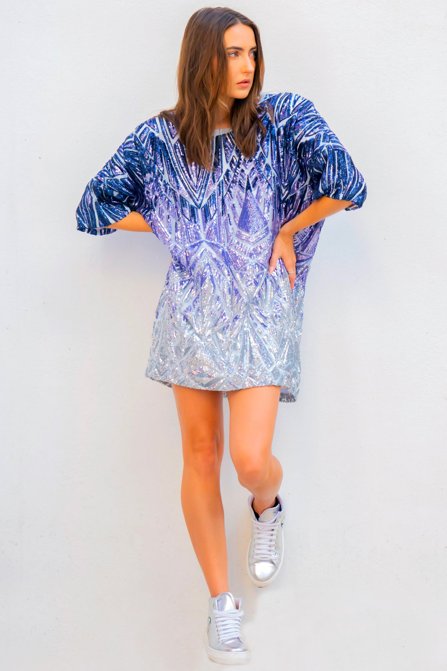 Instant sophistication day or night with a top that's as versatile as it is flattering. Inspired by her evening gown collection, Donna Leah has launched this new collection of five oversized tops that are all about shine, color, and confidence.  The Sizzle Series is a collection of a variety of colors and hues of sparkles, each Sizzle is a different shine no 2 alike.