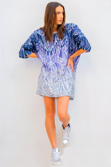 Instant sophistication day or night with a top that's as versatile as it is flattering. Inspired by her evening gown collection, Donna Leah has launched this new collection of five oversized tops that are all about shine, color, and confidence.  The Sizzle Series is a collection of a variety of colors and hues of sparkles, each Sizzle is a different shine no 2 alike.