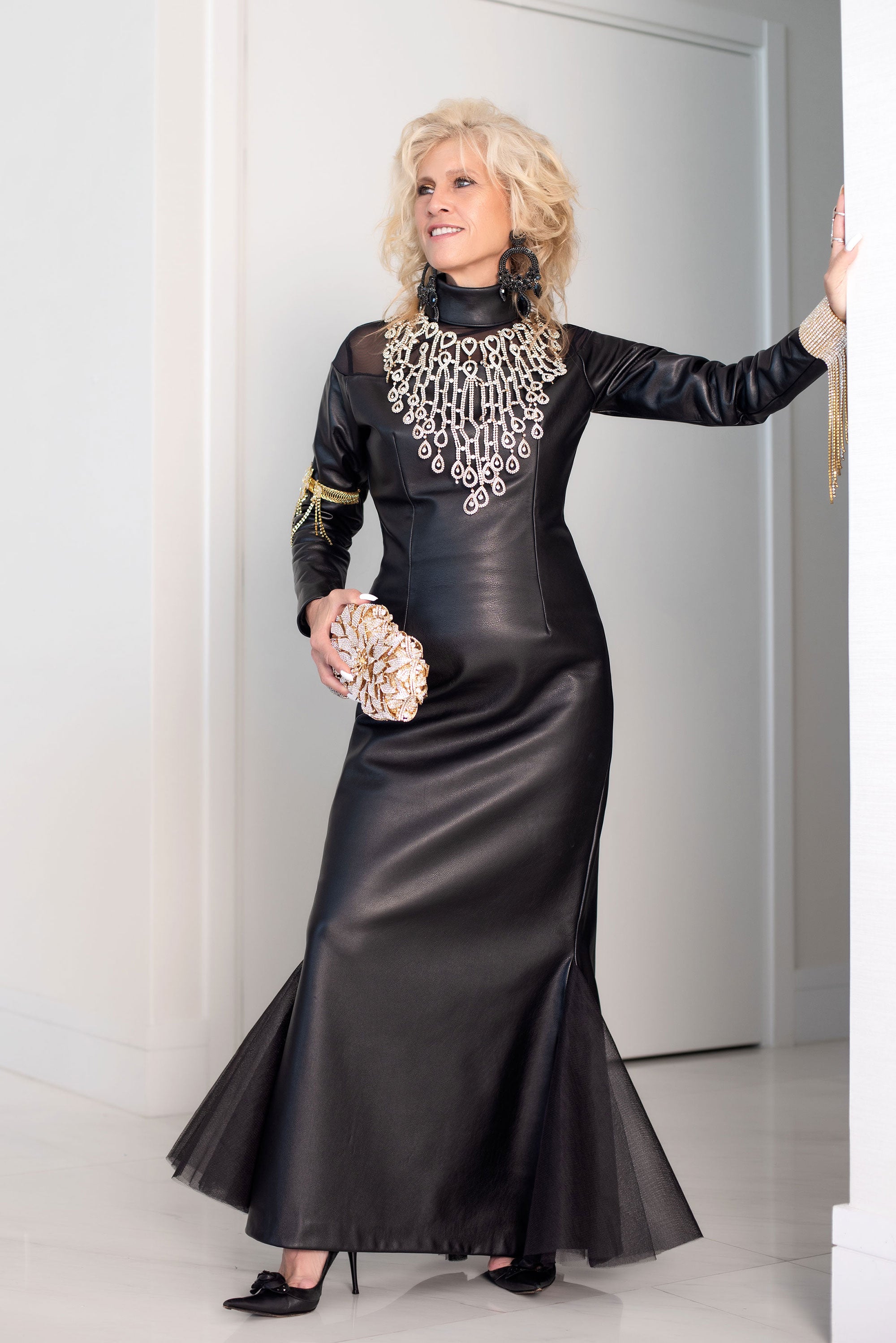 Lot 190 - A Versace black leather and lace evening